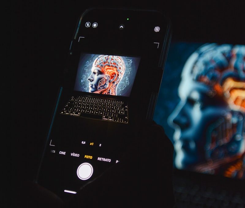 a cell phone sitting on top of a laptop computer